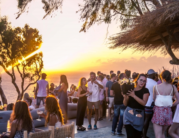 mykonos greece sunset bar party people
